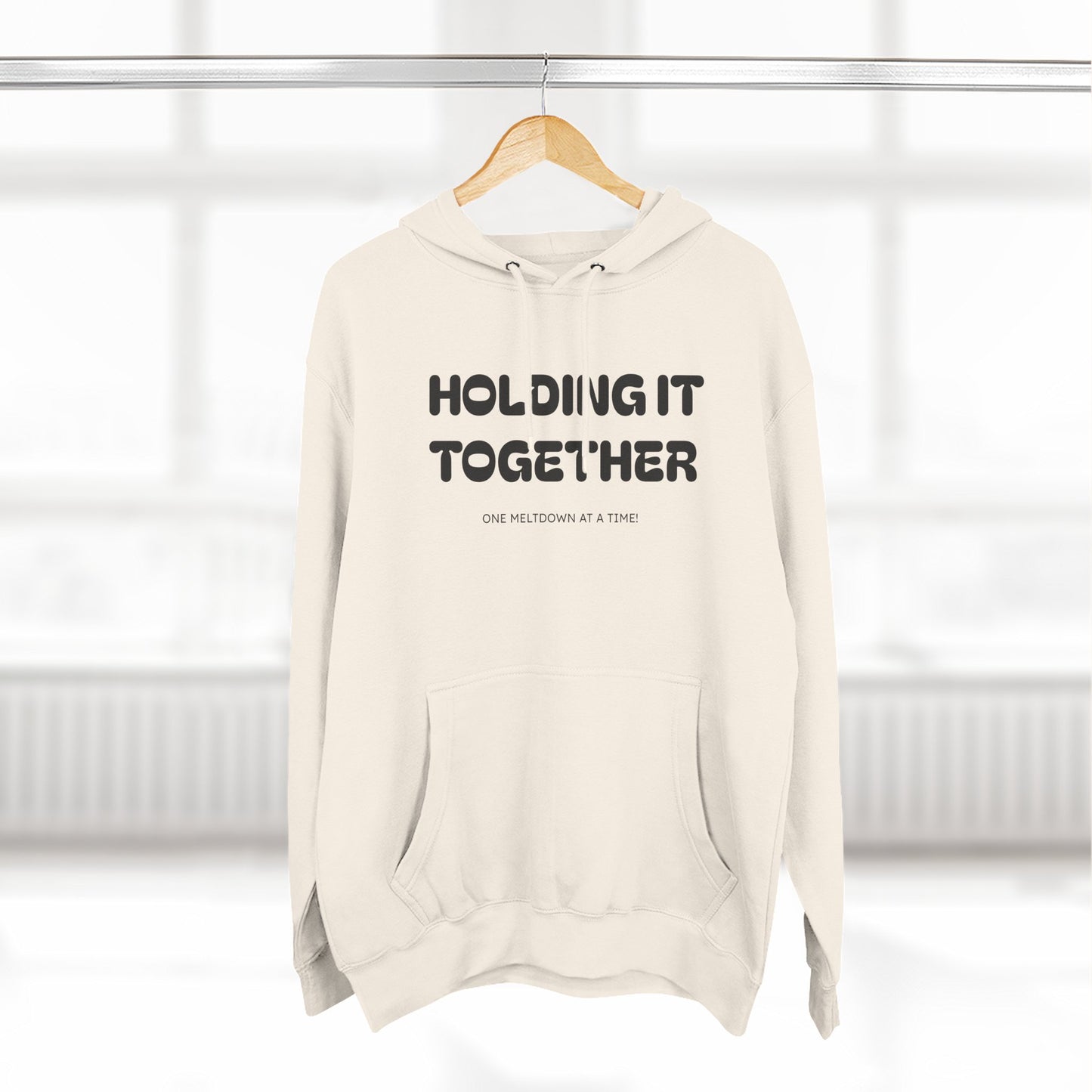 Holding It Together, One Meltdown at a Time” Hoodie – Funny Millennial Parent Sweatshirt