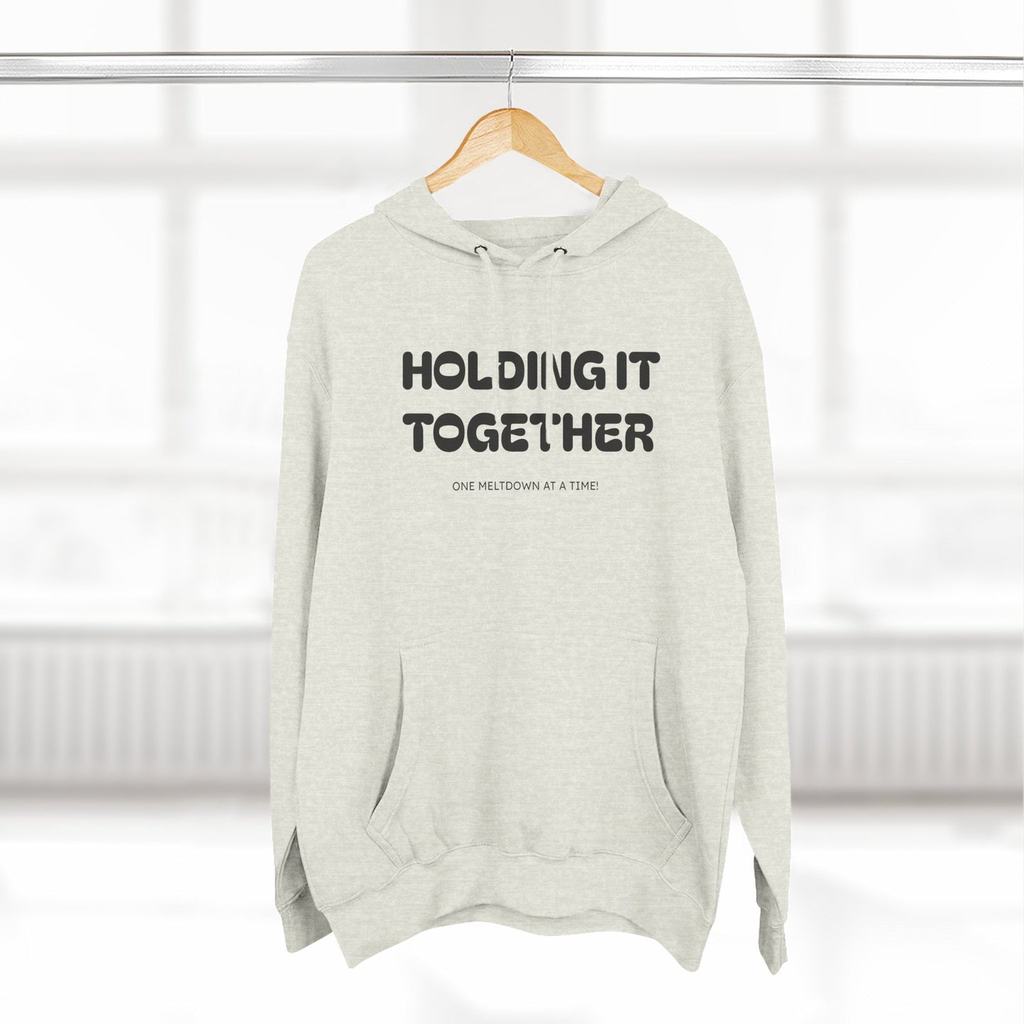 Holding It Together, One Meltdown at a Time” Hoodie – Funny Millennial Parent Sweatshirt