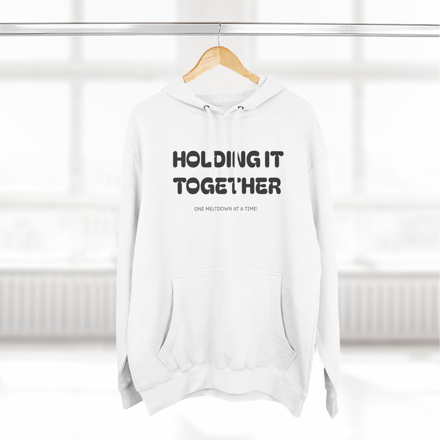 Holding It Together, One Meltdown at a Time” Hoodie – Funny Millennial Parent Sweatshirt