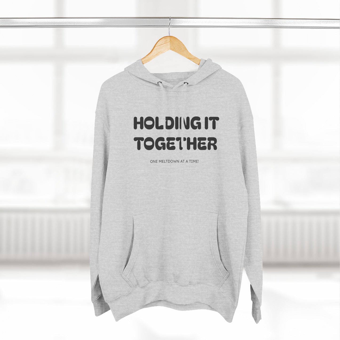 Holding It Together, One Meltdown at a Time” Hoodie – Funny Millennial Parent Sweatshirt