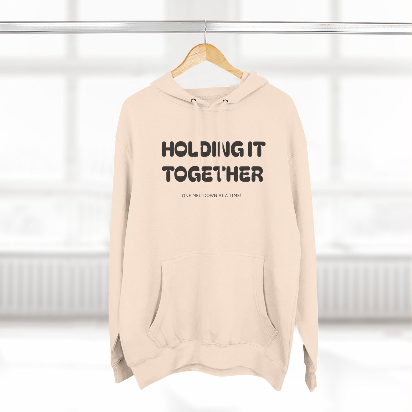 Holding It Together, One Meltdown at a Time” Hoodie – Funny Millennial Parent Sweatshirt