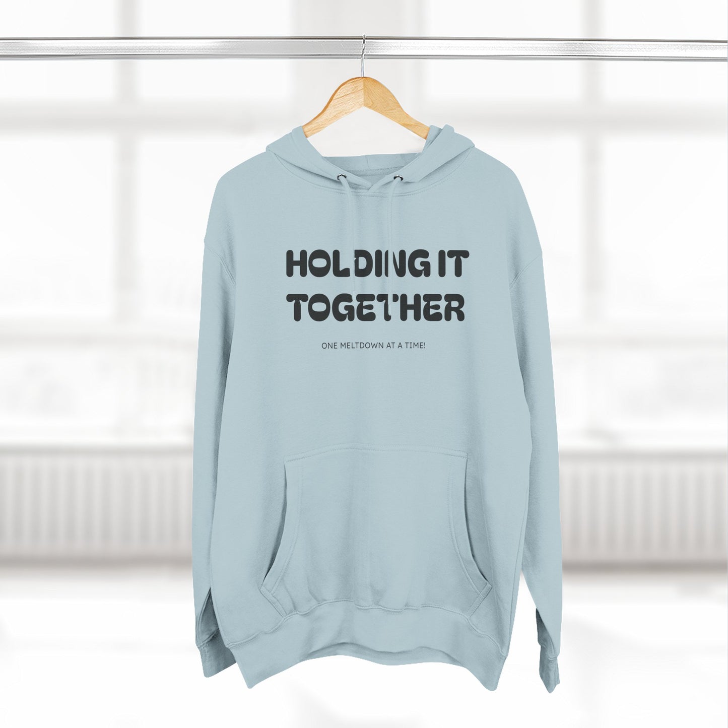 Holding It Together, One Meltdown at a Time” Hoodie – Funny Millennial Parent Sweatshirt