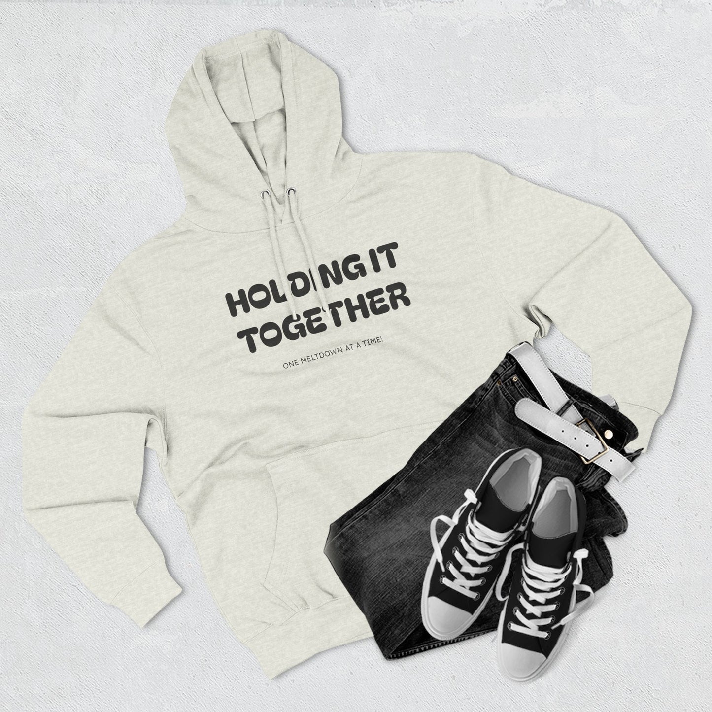 Holding It Together, One Meltdown at a Time” Hoodie – Funny Millennial Parent Sweatshirt