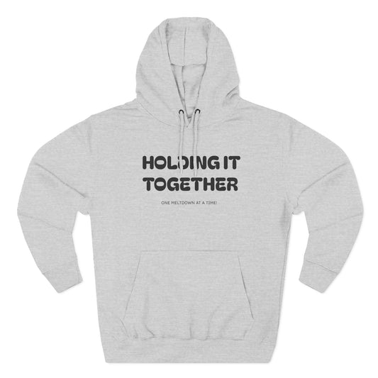 Holding It Together, One Meltdown at a Time” Hoodie – Funny Millennial Parent Sweatshirt